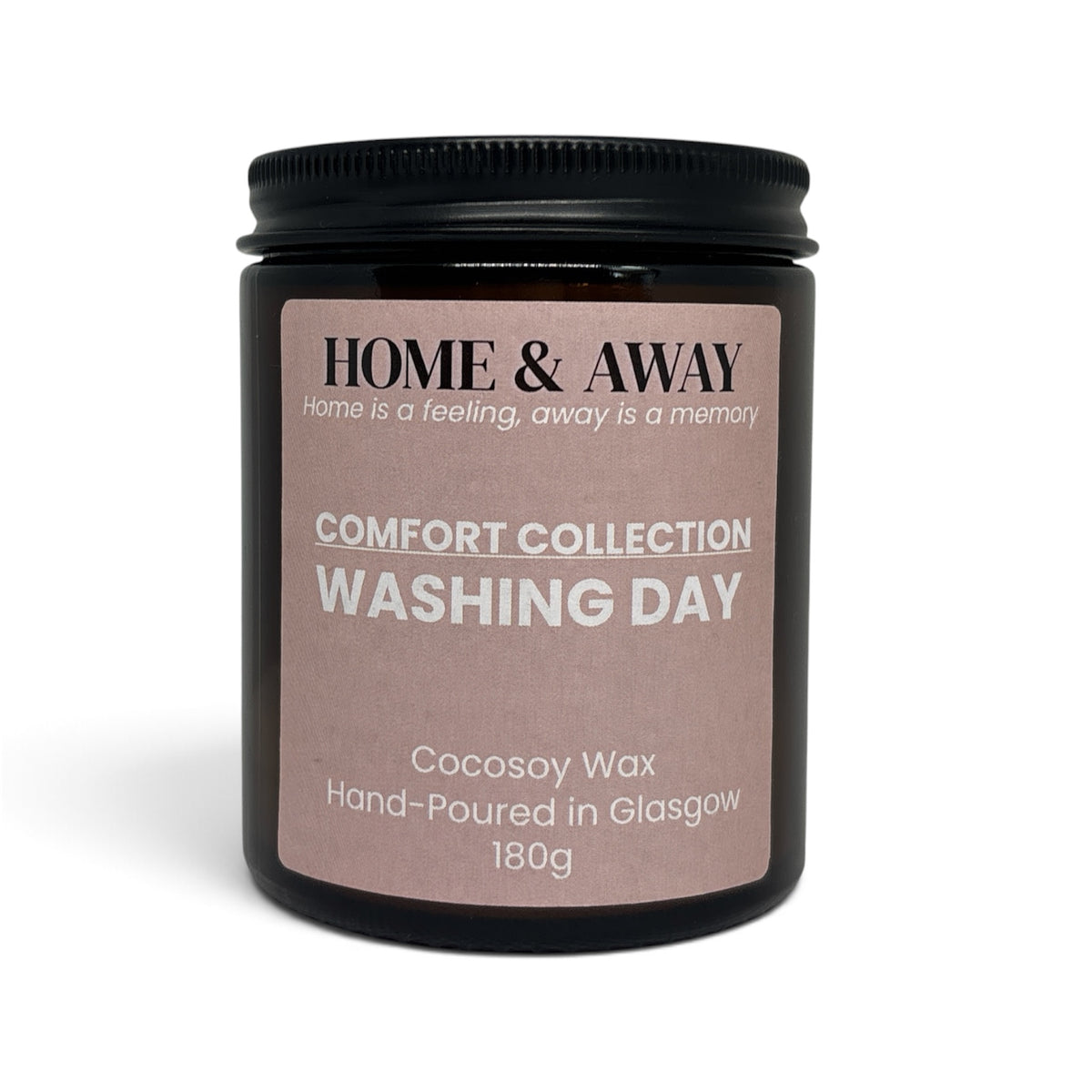 Washing Day candle from the Comfort Collection in an amber glass jar with a black lid, hand-poured by Home & Away Candles