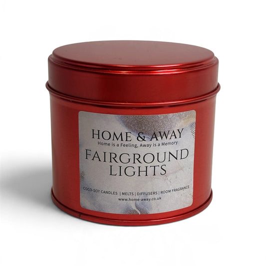 Fairground Lights Christmas candle in a glossy red tin, hand-poured by Home & Away Candles