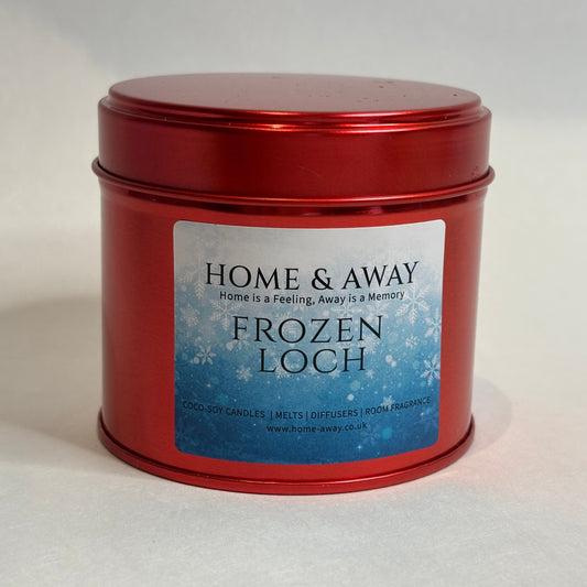 Frozen Loch Christmas candle in a glossy red tin, hand-poured by Home & Away Candles