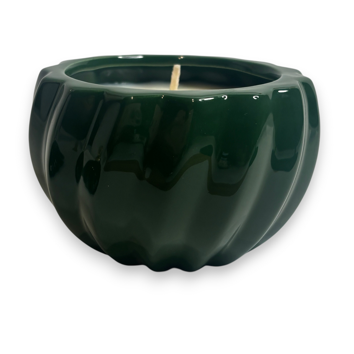 Home-away.co.uk green ceramic Christmas bauble candle with a glossy ribbed finish and single wick